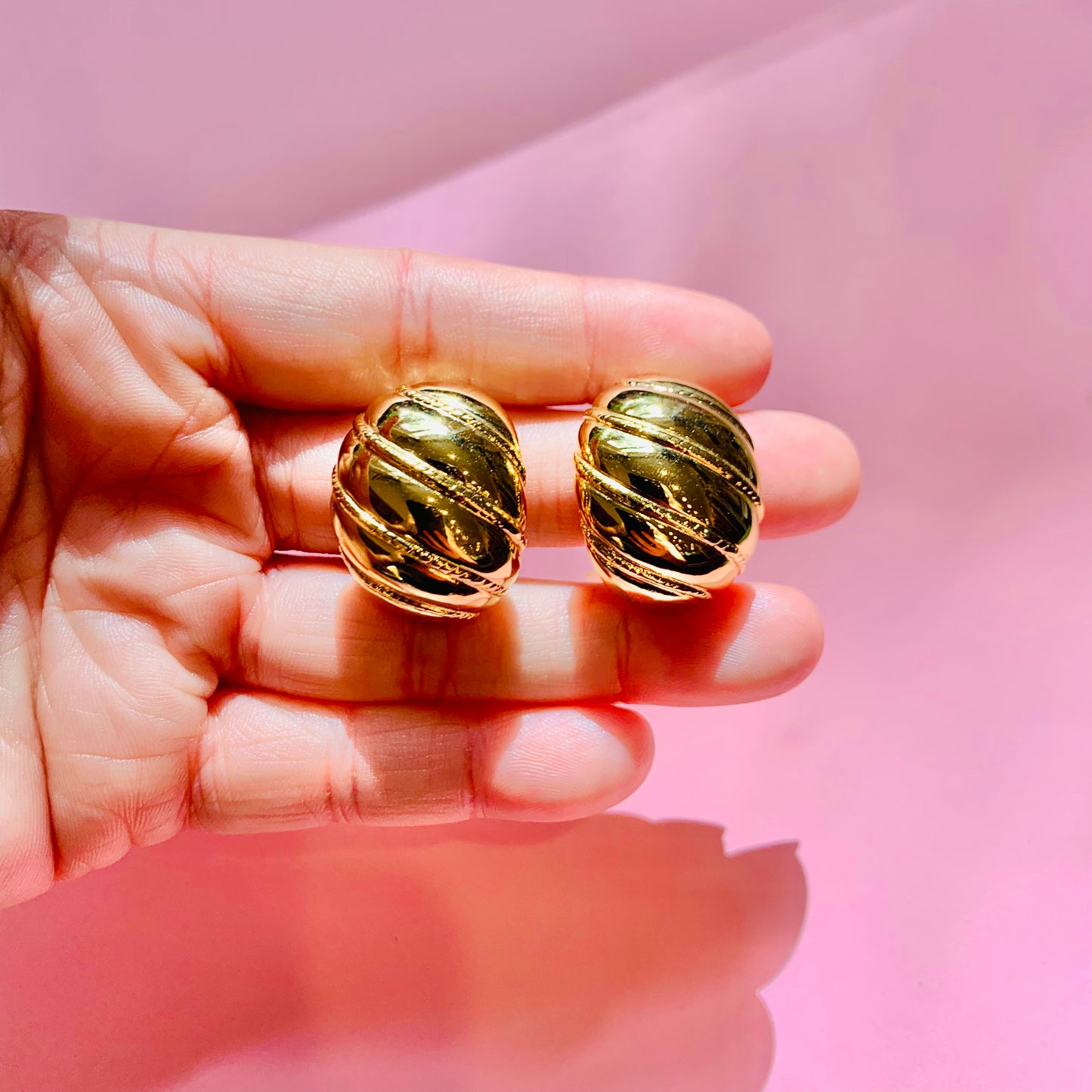 1960s Barcs triple gold plated ribbed cocoon clip on earrings by Monet