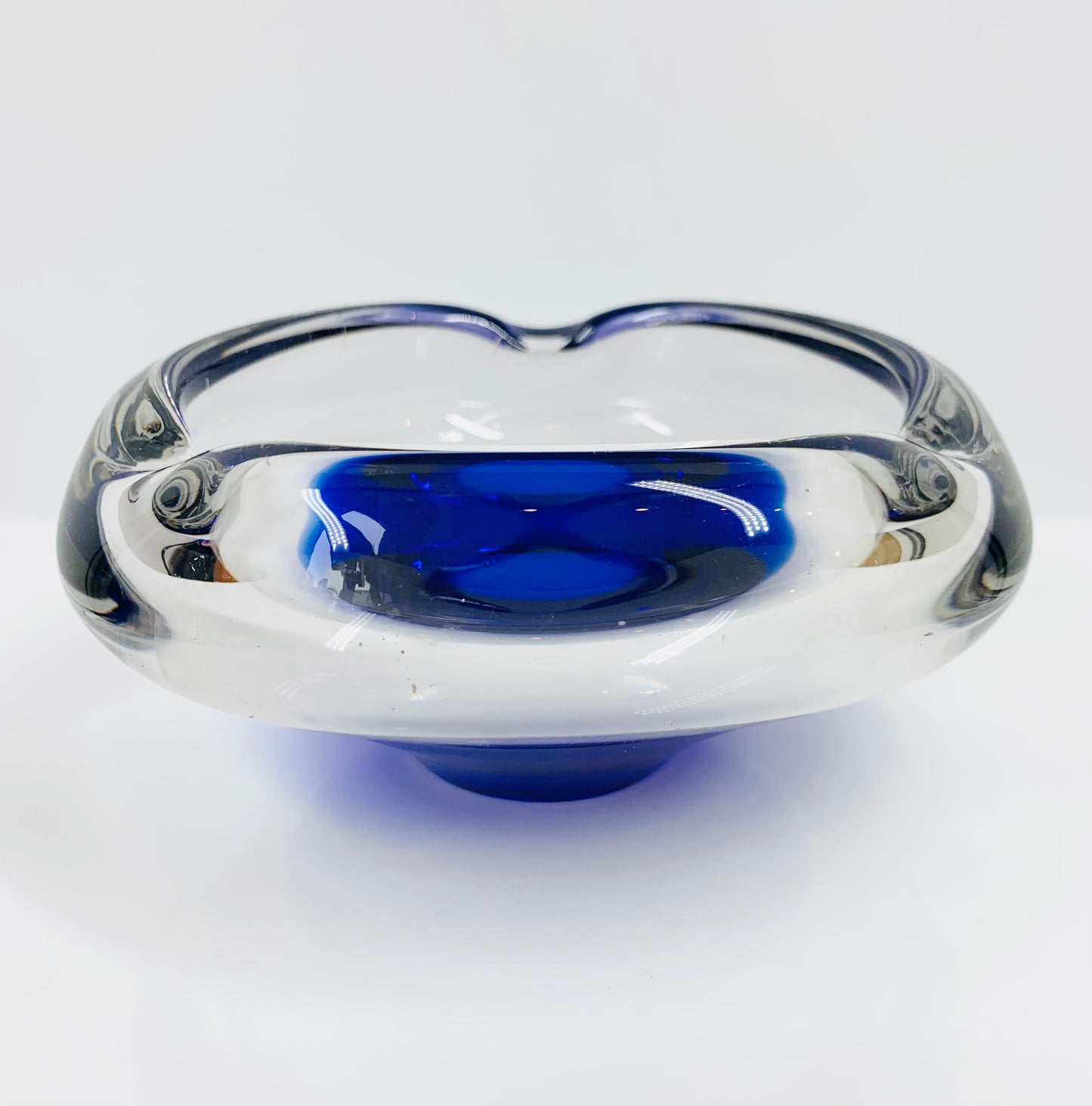 MCM Dutch Maastricht clear glass ashtray with blue sommerso base