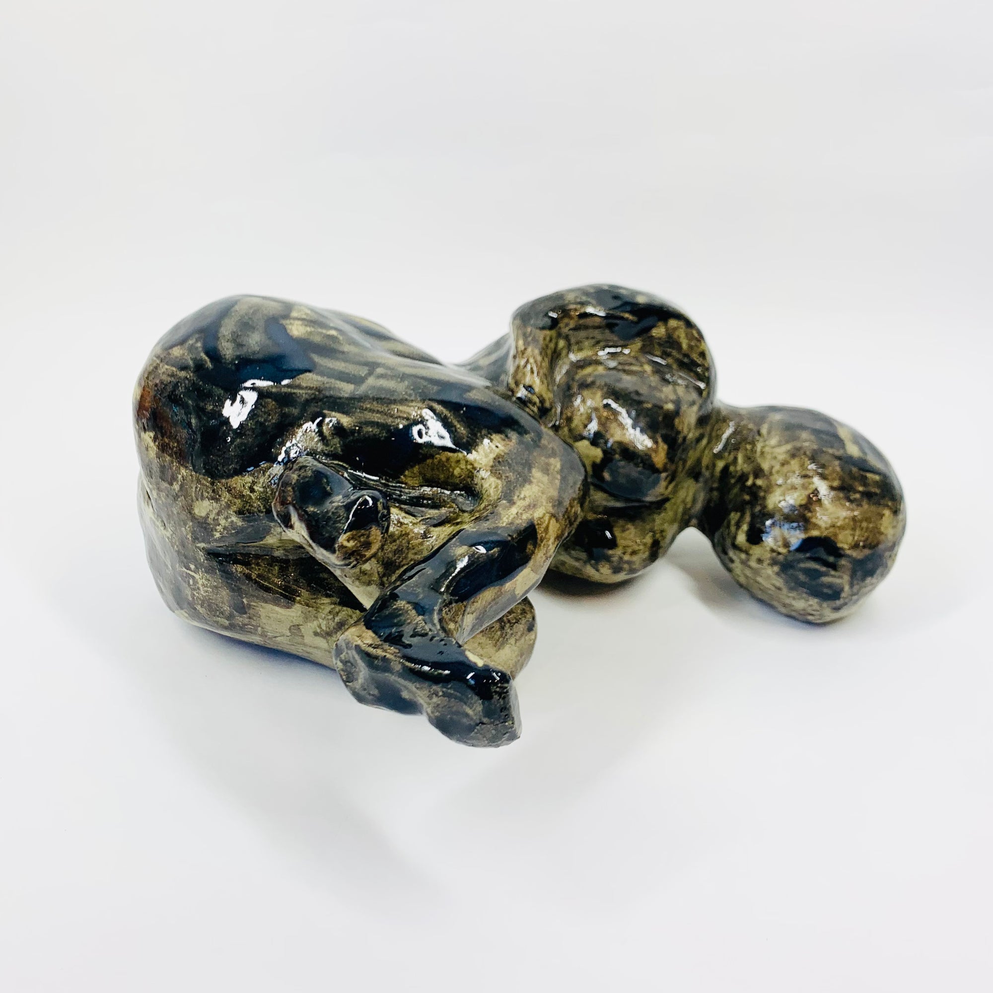 Australian pottery sculpture depicting woman clutching her stomach