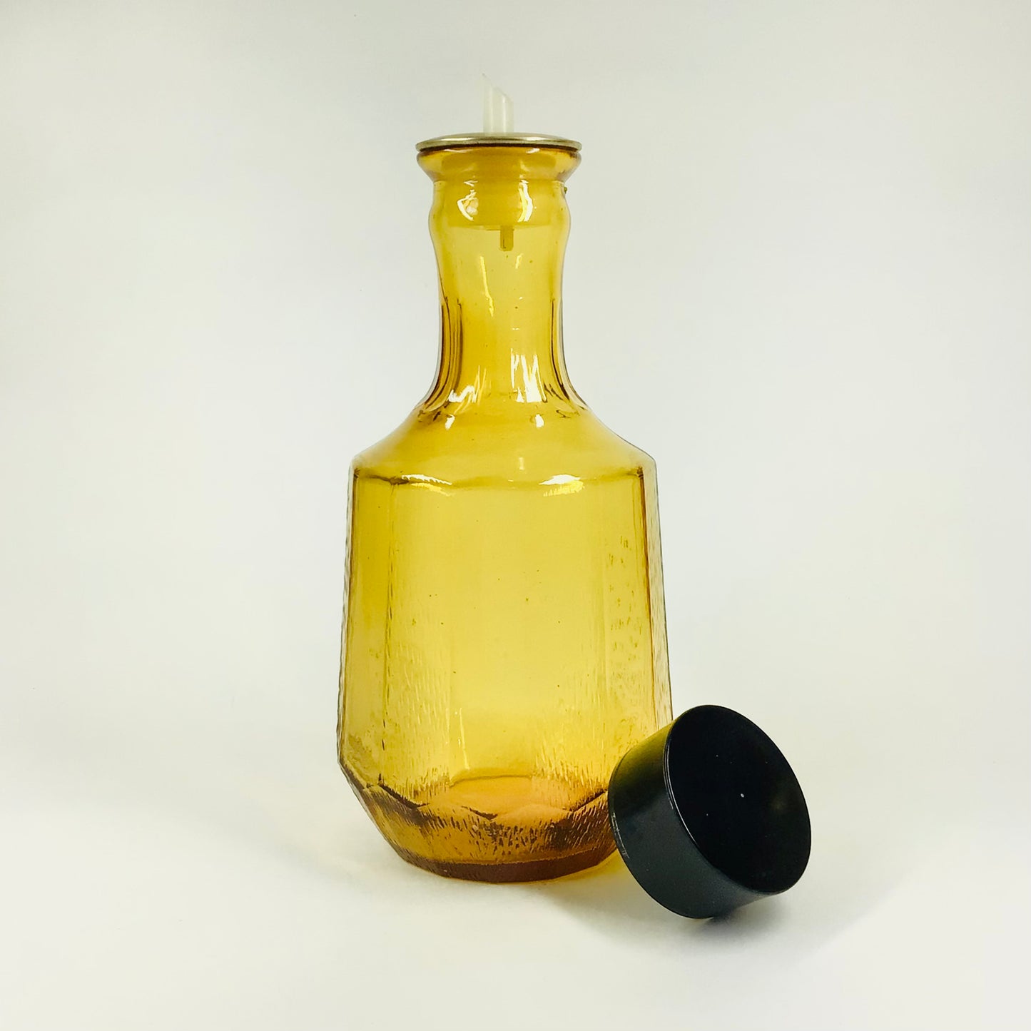 Midcentury glass oil carafe with plastic lid