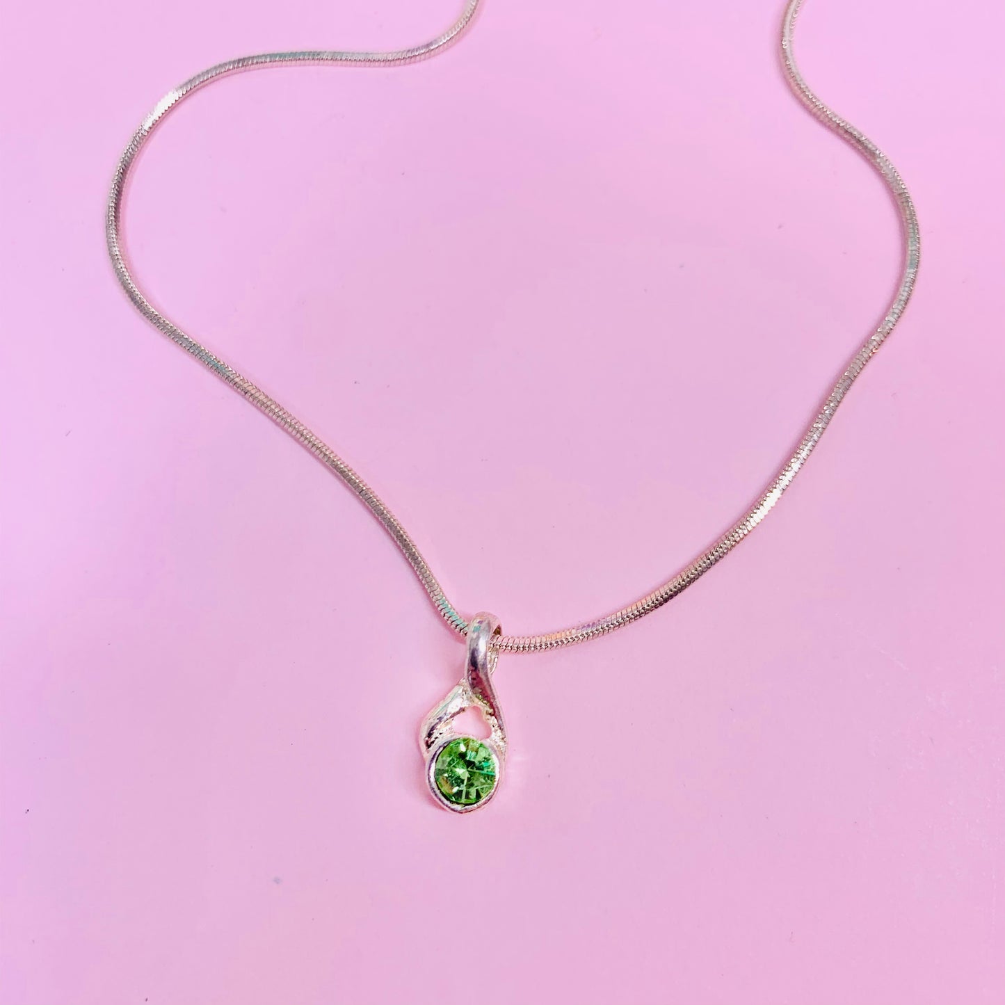 1970s silver plated chain with green rhinestone pendant