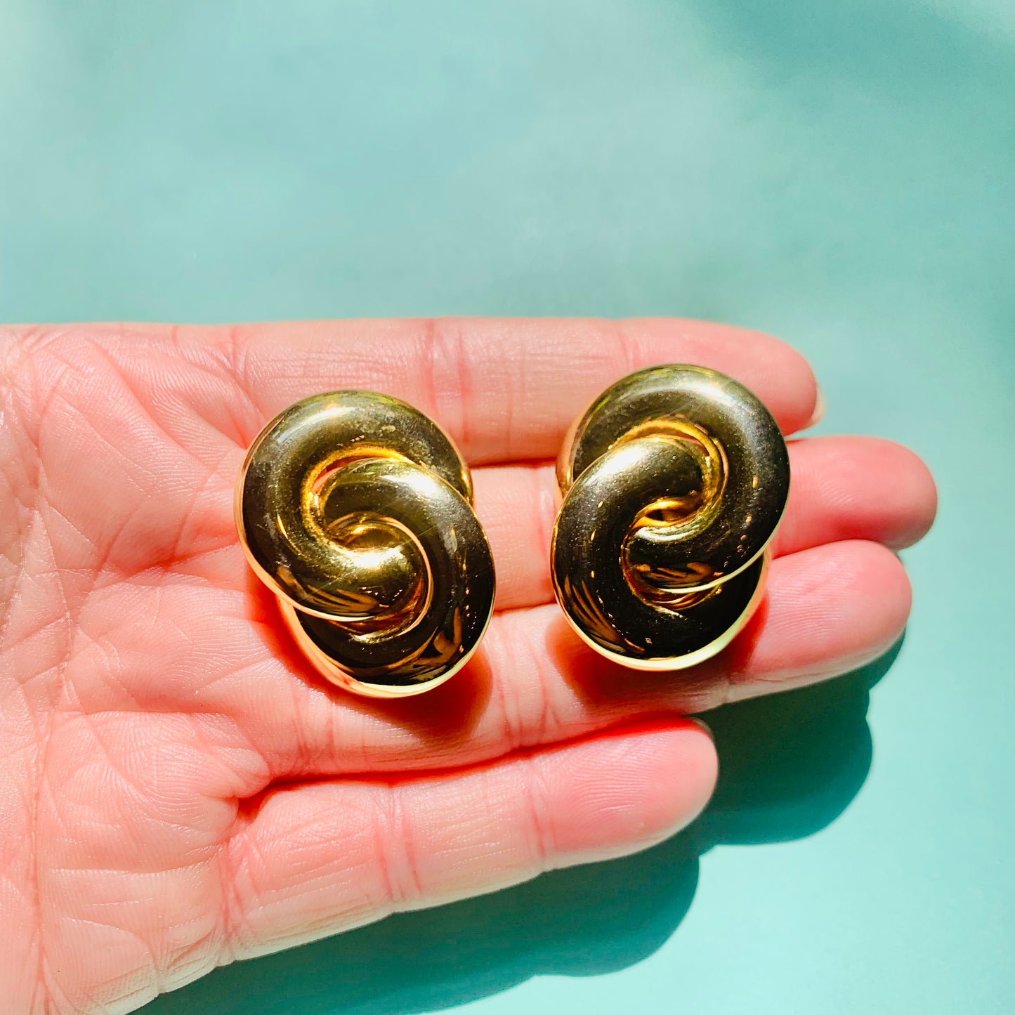 Rare 1980s triple gold plated double hoops knot clip on earrings by Monet