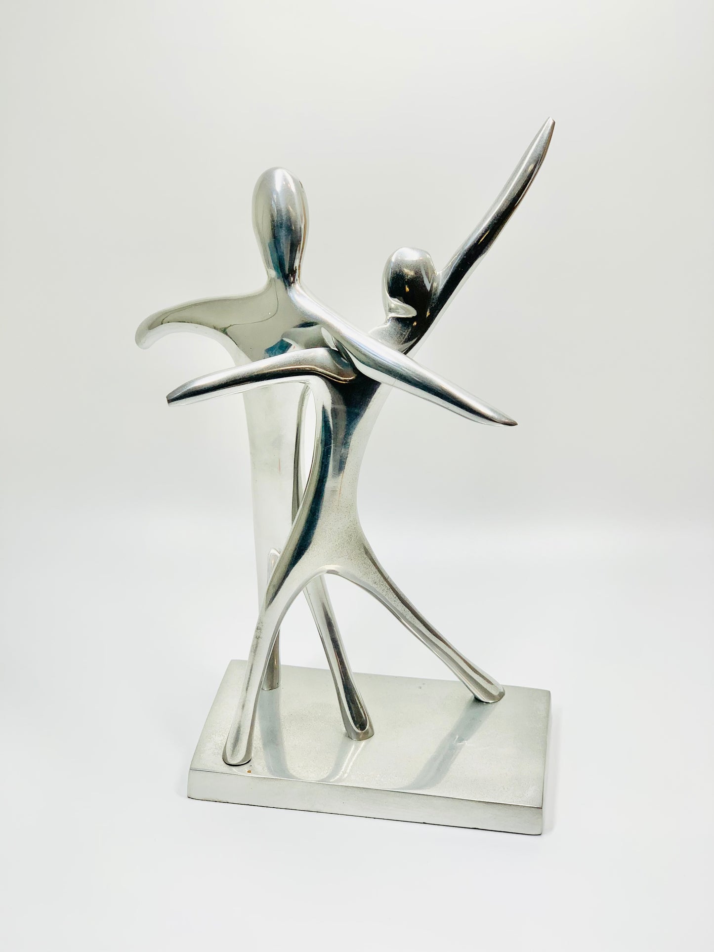 MCM stainless steel abstract dancing couple sculpture on matching stand