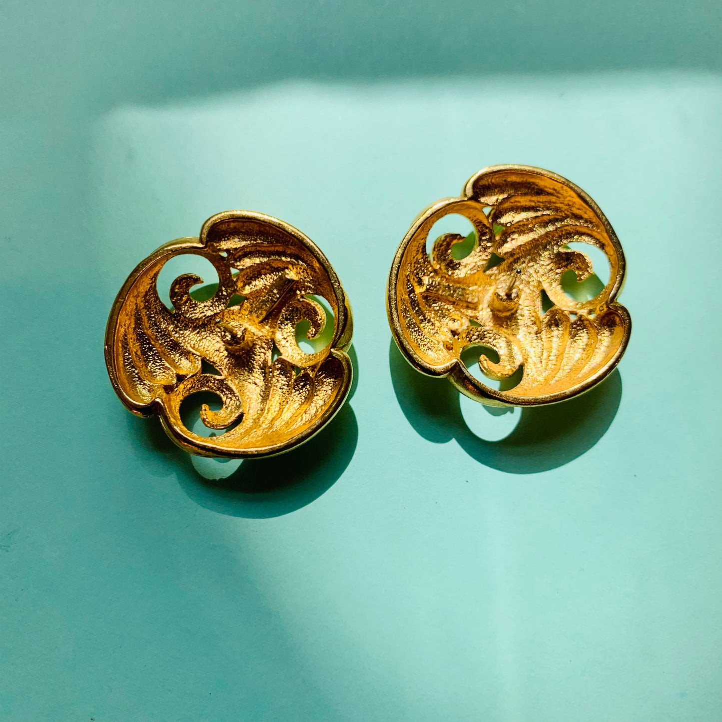 1980s French triple plated gold trilogy scrolls knot stud earrings