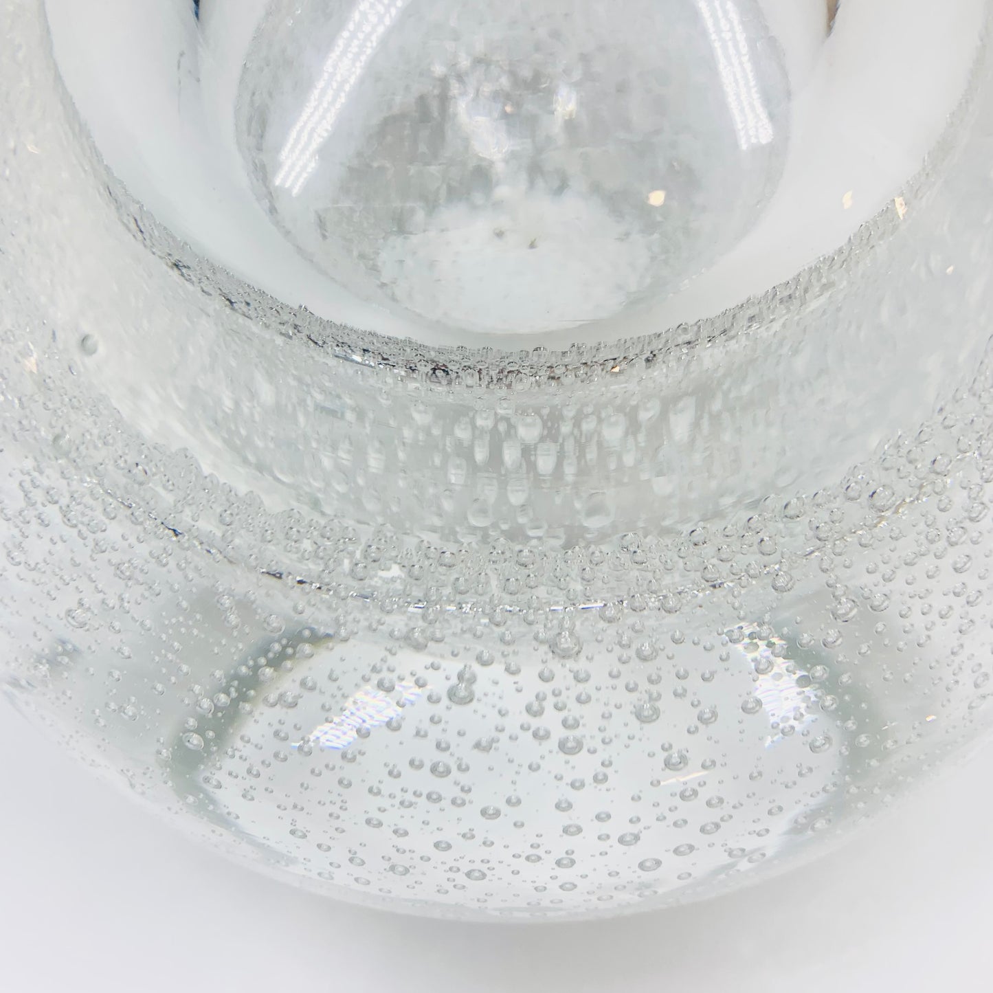 Polish glass orb with controlled bubbles