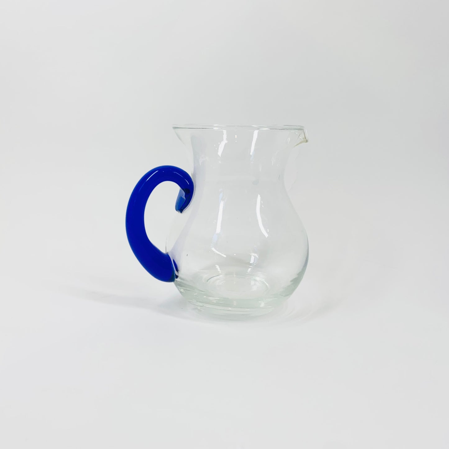 Vintage glass mini jug with blue handle