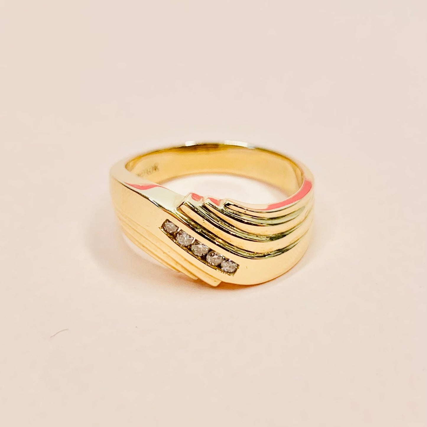 1970s 10K gold ring set with channel diamonds