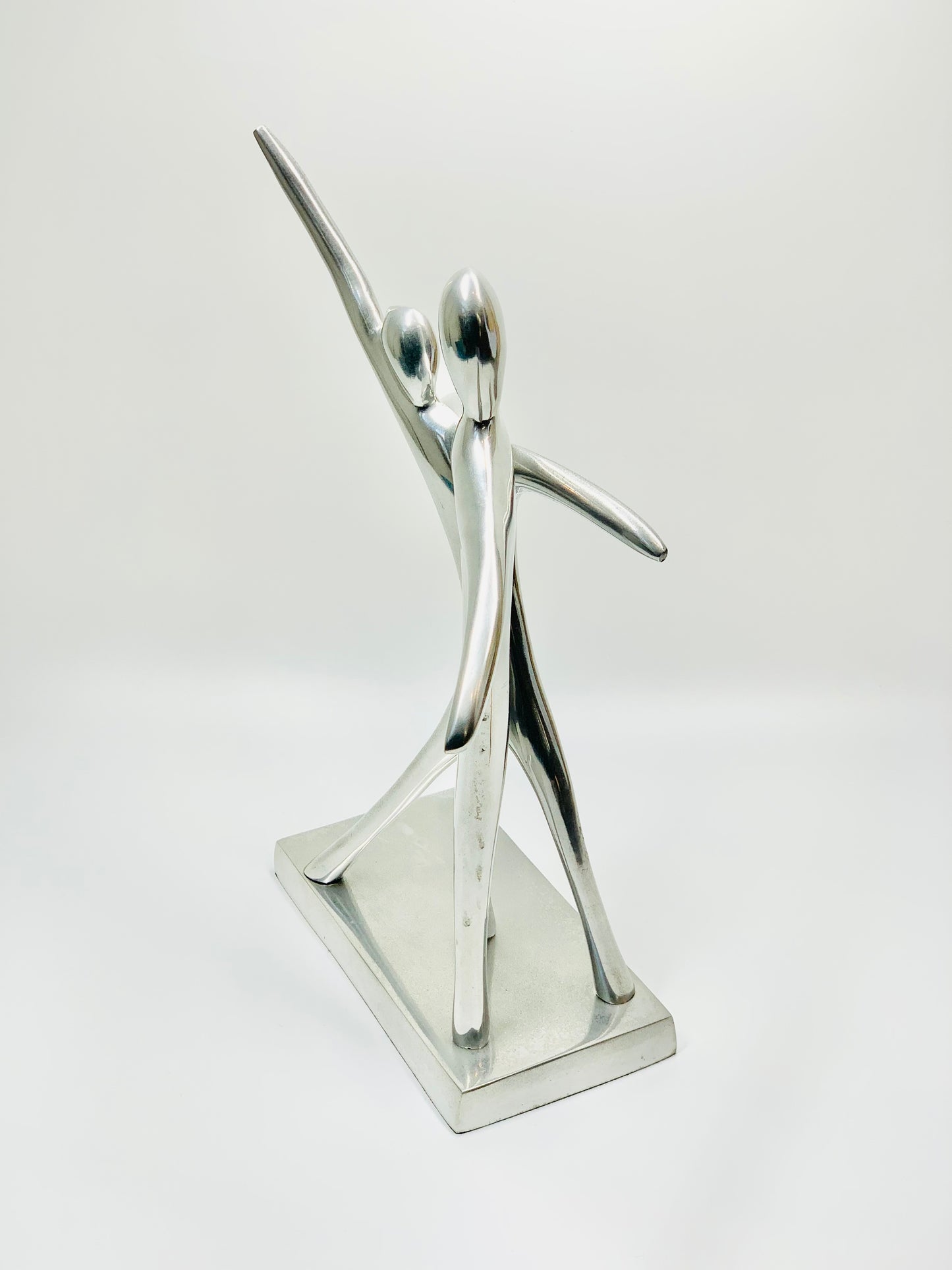 MCM stainless steel abstract dancing couple sculpture on matching stand