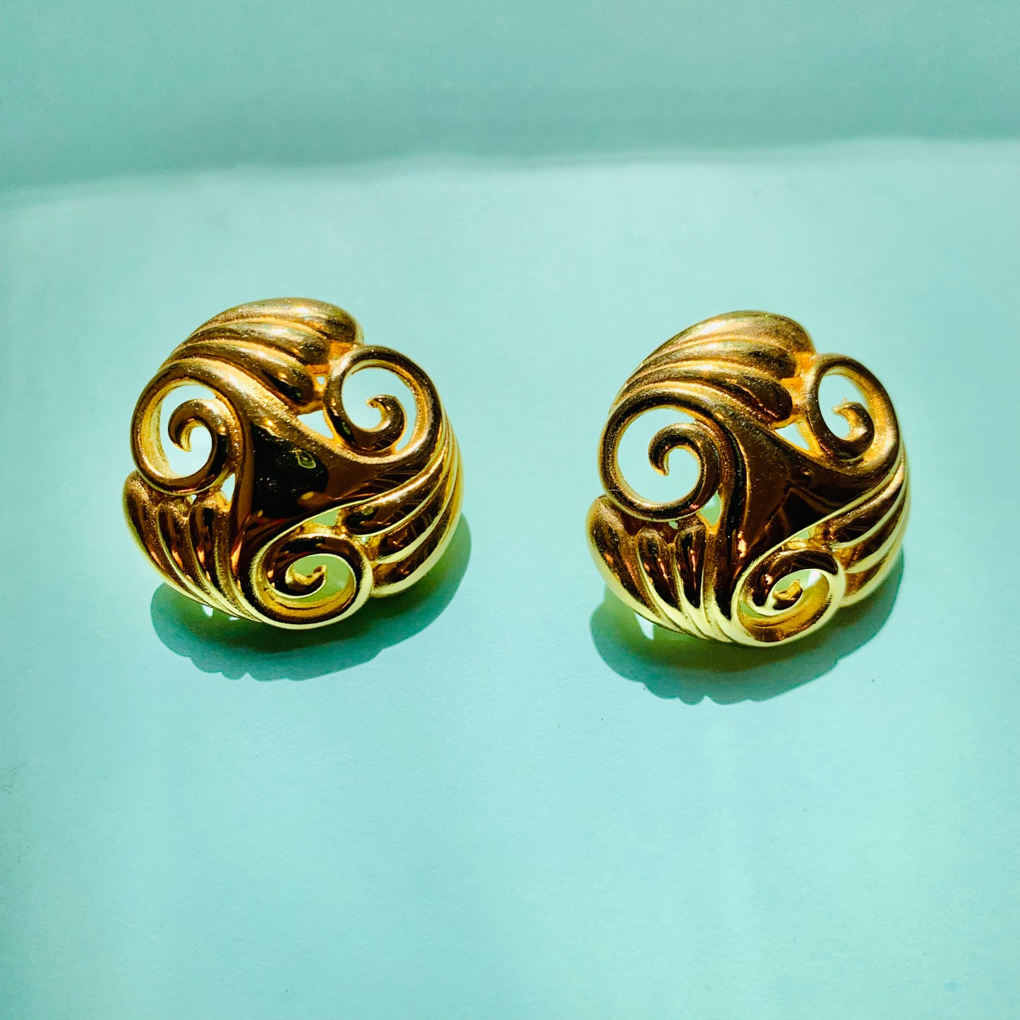 1980s French triple plated gold trilogy scrolls knot stud earrings