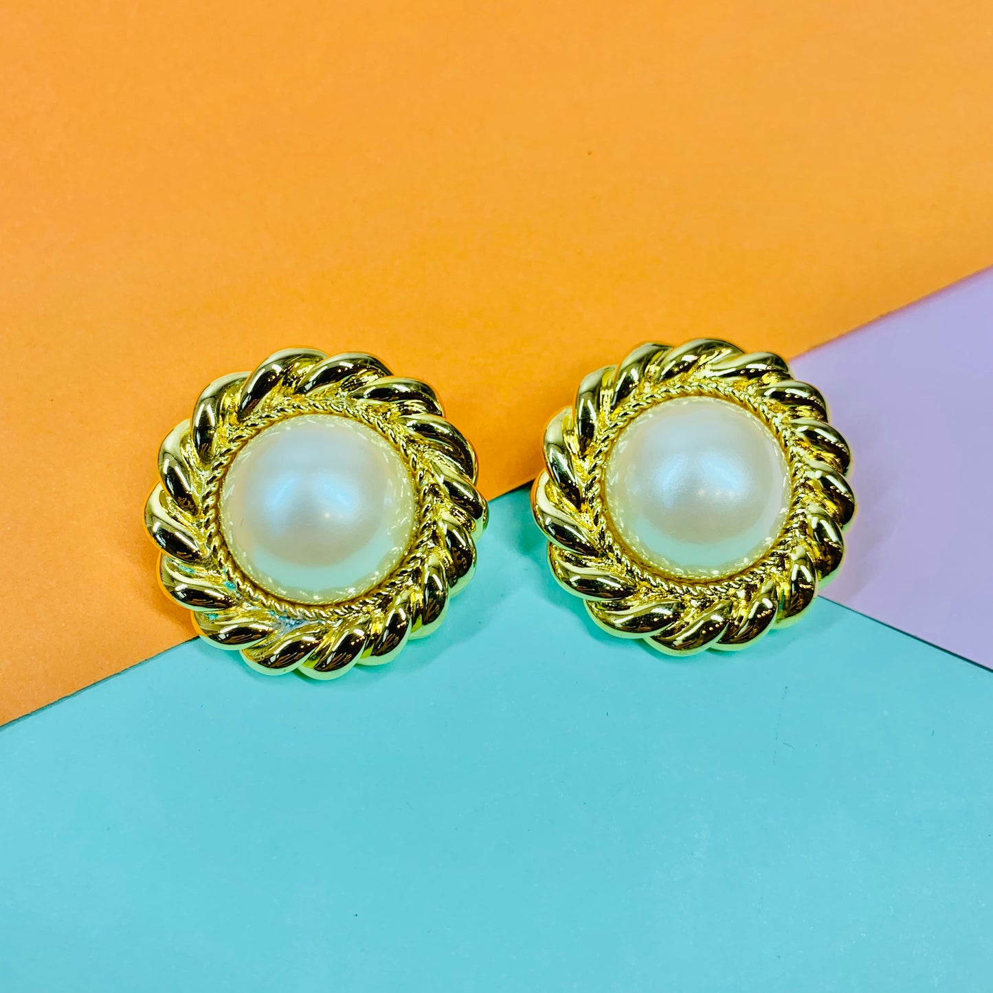 1980s large gold plated clip on filigree pearl button earrings with filigree border