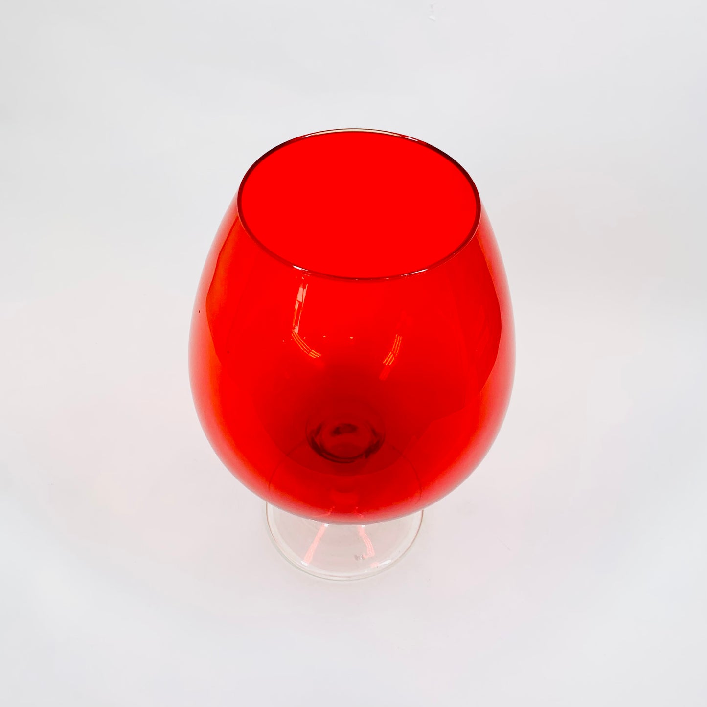 Large Midcentury Italian red glass brandy balloon vase with clear stem