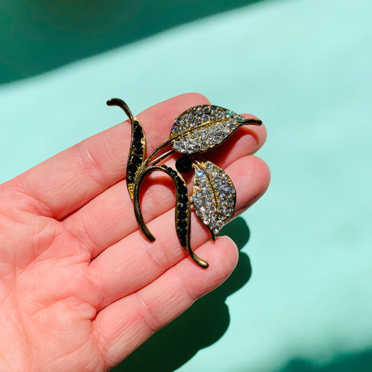 1980s brass leaves brooch with clear and black rhinestone